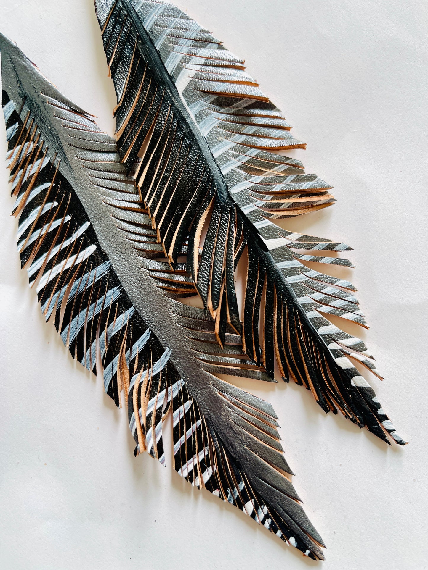LEATHER FEATHERS